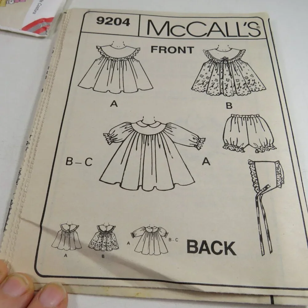 McCalls 9204 Sewing Clothing Pattern NEW BORN size Pinafore Dress, Bonnet, etc.